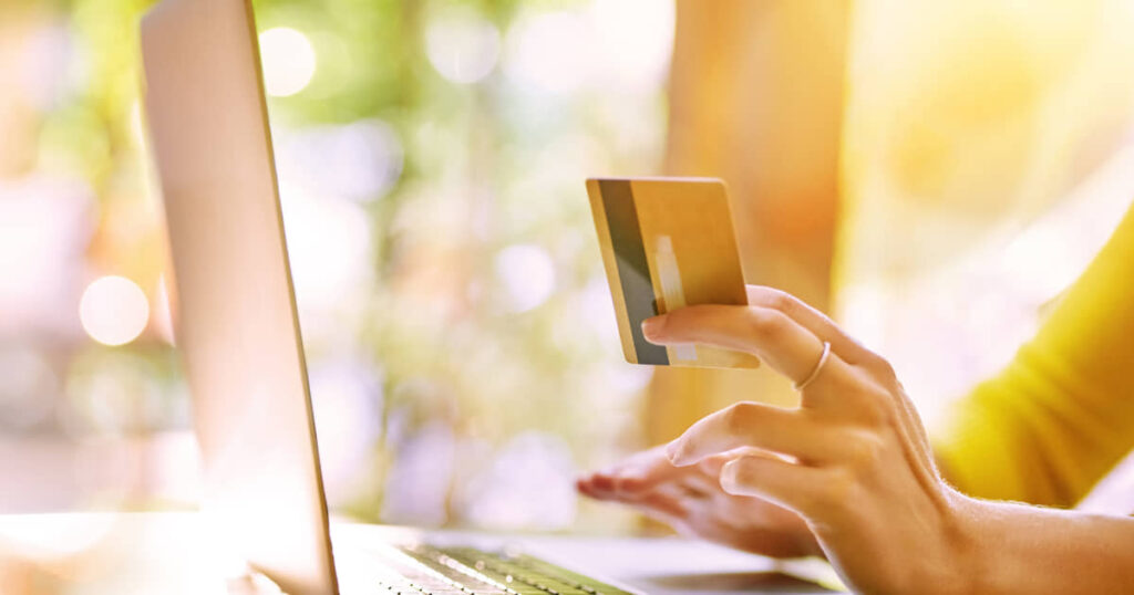 Man using credit card for shopping online