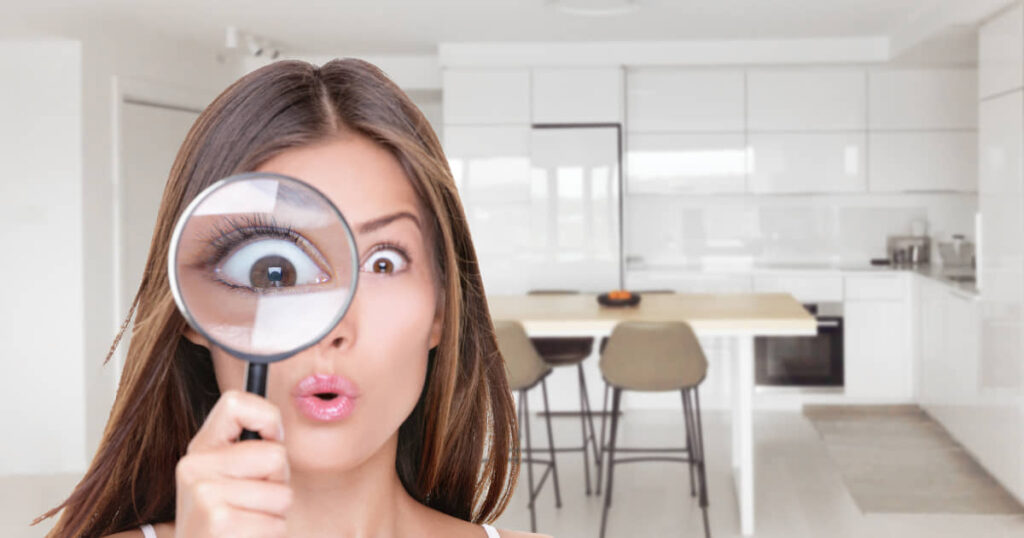 Woman looking for discounts with magnifying glass